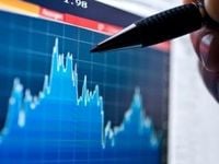 Hand pointing to chart with pen