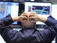 image of trader and charts