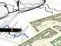 pen and glass on stock charts