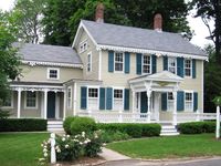 Suburban house with green shutters