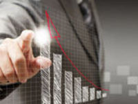 man pointing to rising graph 