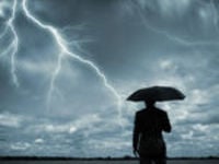 man with umbrella and lightning