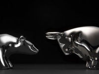 Silver bear and bull facing off