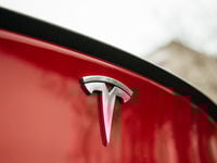 Tesla Logo on a Tesla Car