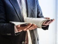 Man holding open a magazine 