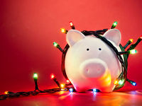 Piggy Bank Wrapped in Christmas String Lights