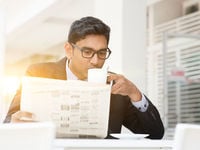 Businessman Reading his Newspapers
