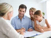 Advisor with Happy Family Clients