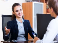 Happy Professional Woman Speaking with Man