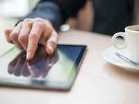 Man reading on Tablet