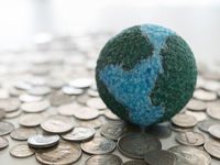 Globe on Pile of Coins