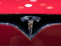 Tesla Surges to Lift Markets Into New Record Close